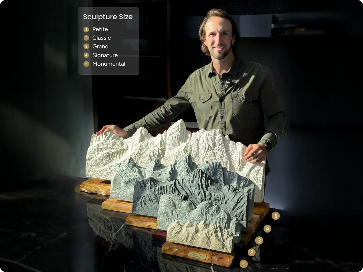 Ben with the five sculpture sizes side by side, from Petite to Monumental