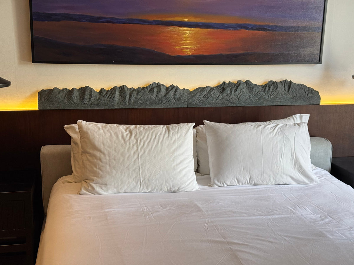 Panorama sculpture above a bed headboard