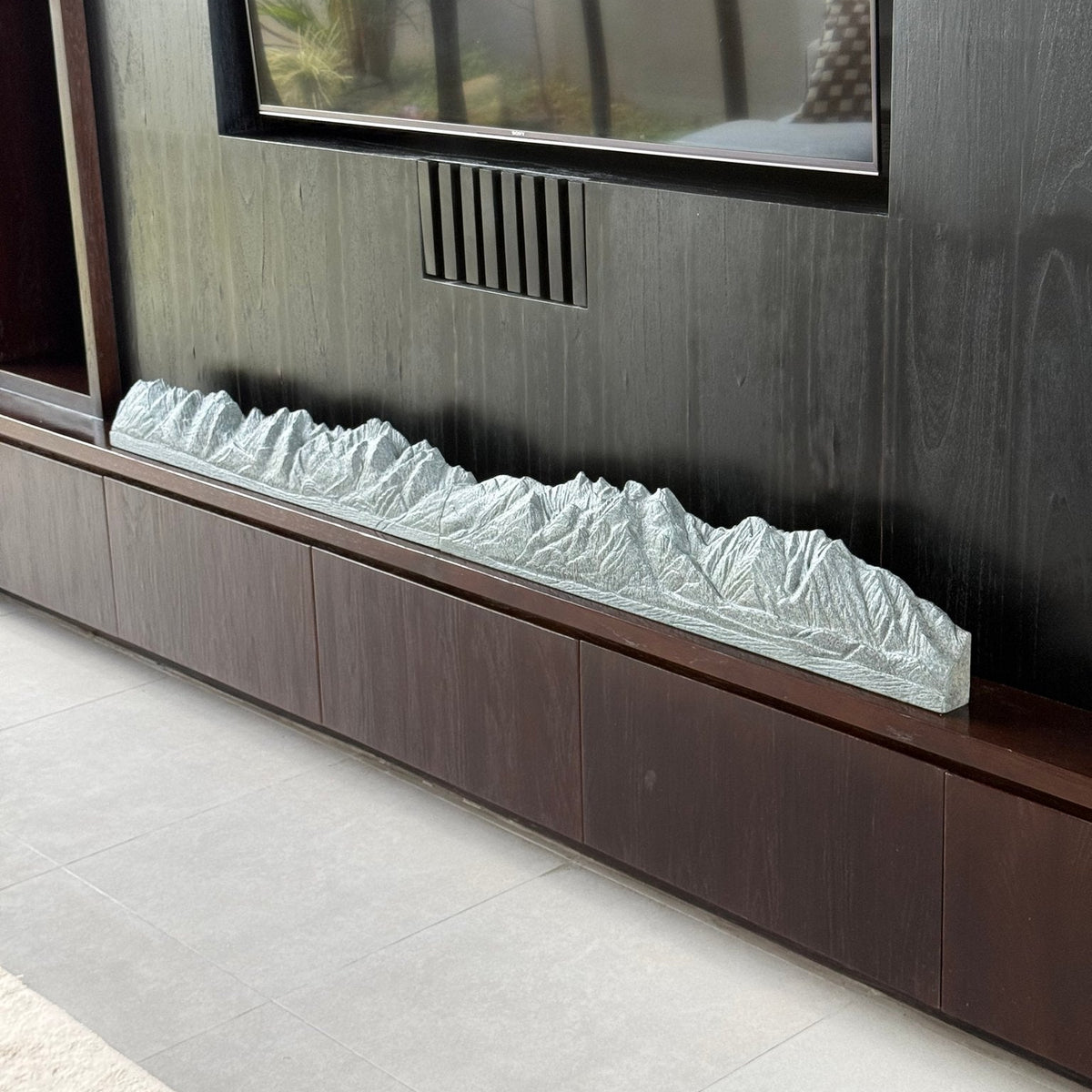 Panorama sculpture on a mantle in a living room